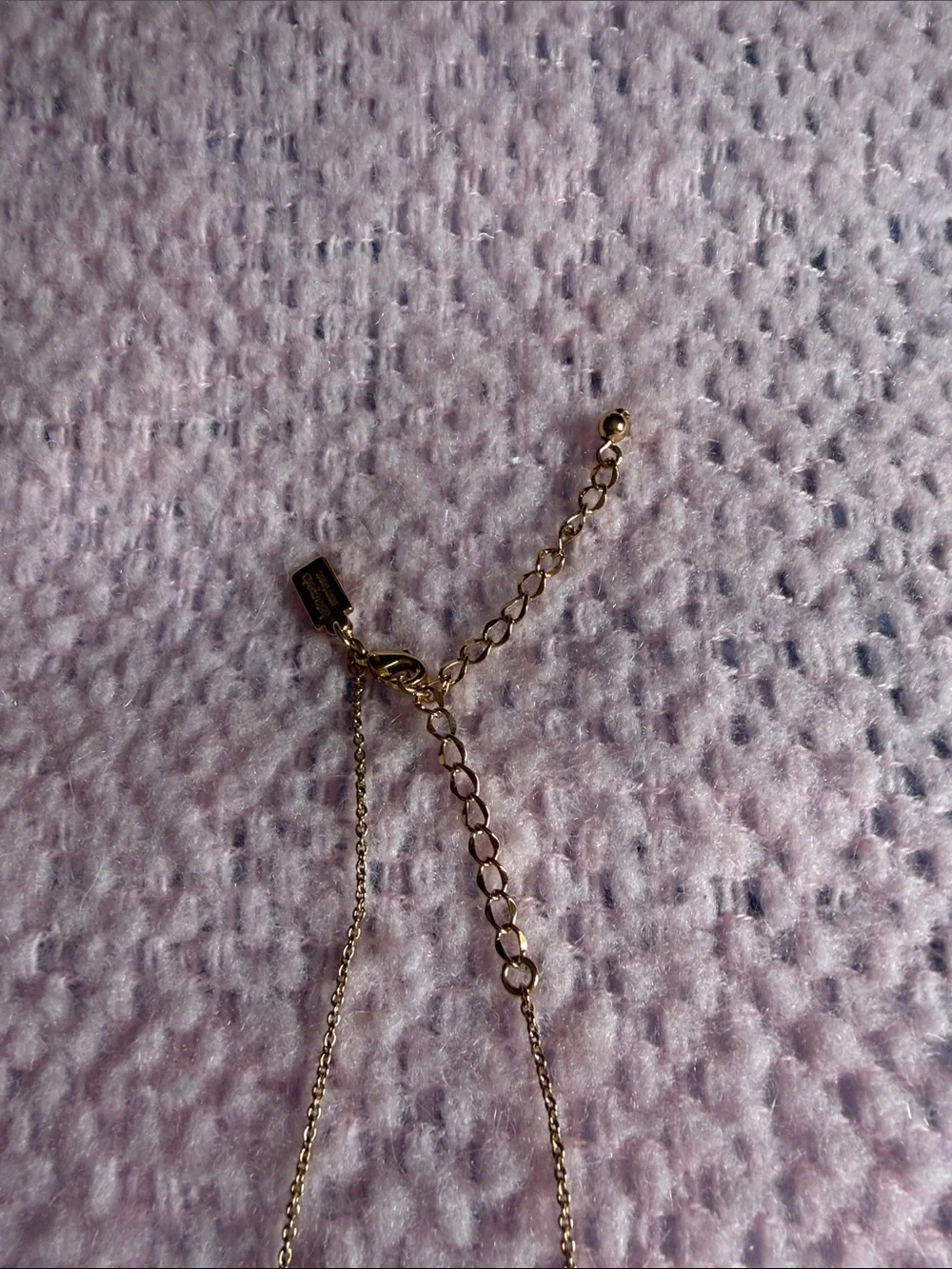 Kate Spade long golden necklace with crystal beads.